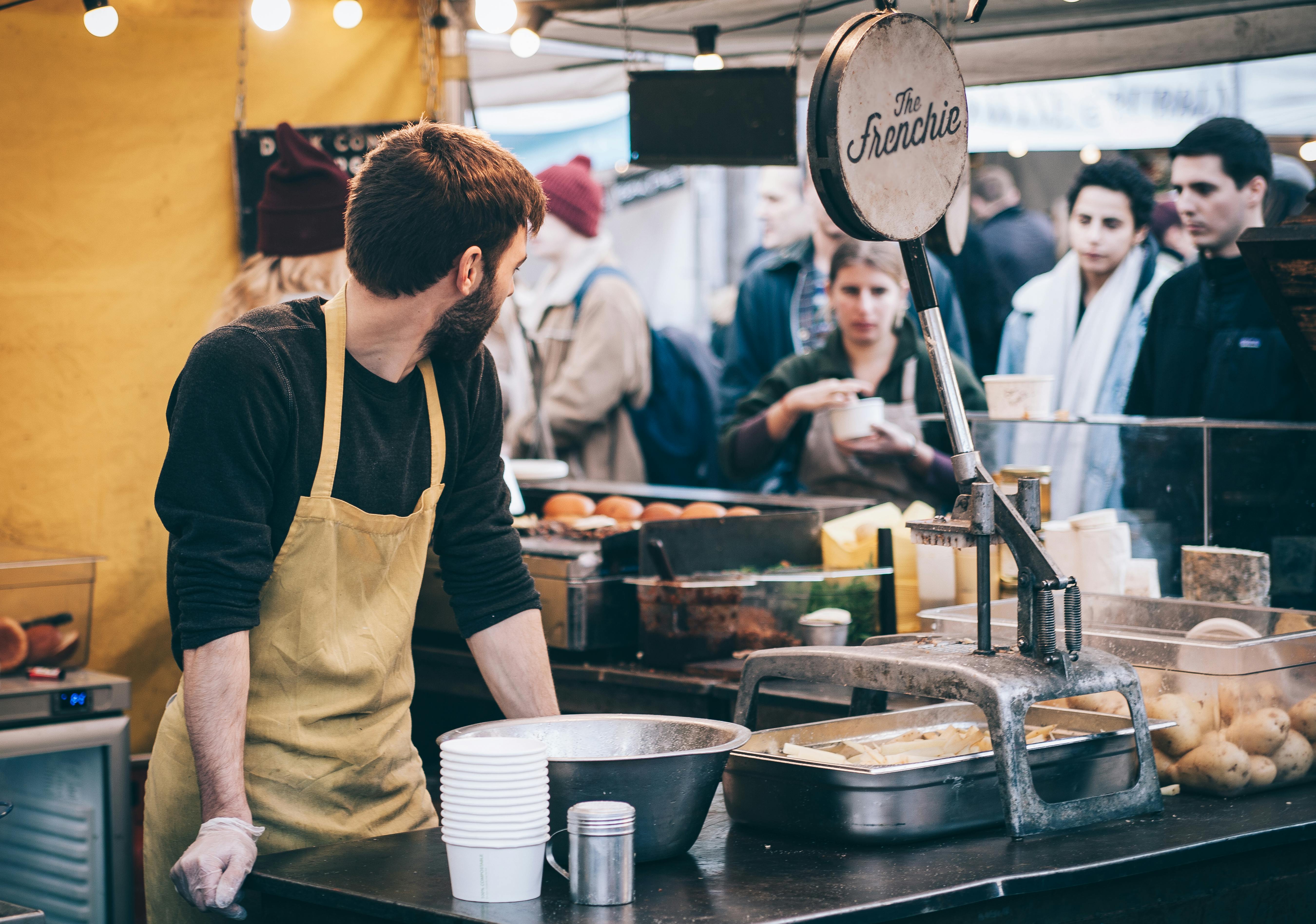 man serving at a restaurant